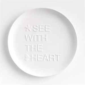 "See with the Heart" 10" White Ceramic Plate by Lucia Eames for Crate&Barrel